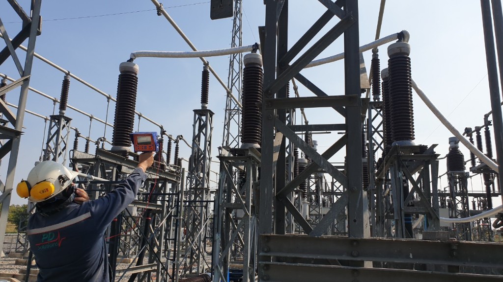 PD Solutions engineer performing PD inspection at outdoor substation